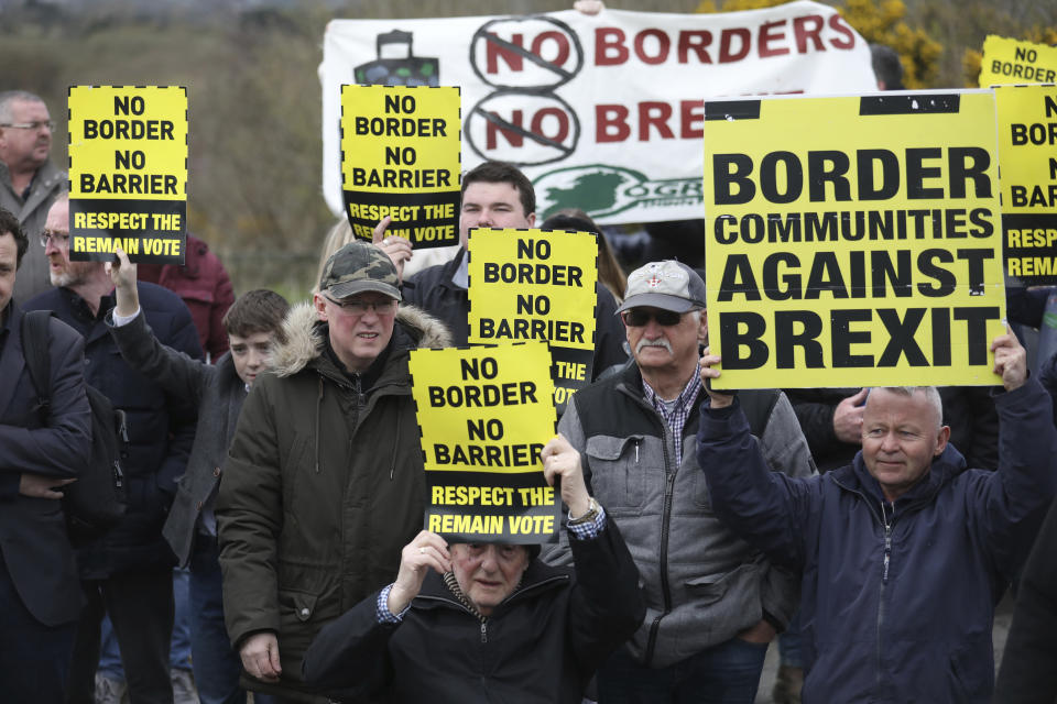 Anti Brexit  demonstrators protest on the Irish border on the Old Dublin Road, Carrickcarnon, Ireland, Saturday, March 30, 2019. Border communities protested against Brexit by holding various rallies around Ireland. (AP Photo/Peter Morrison)