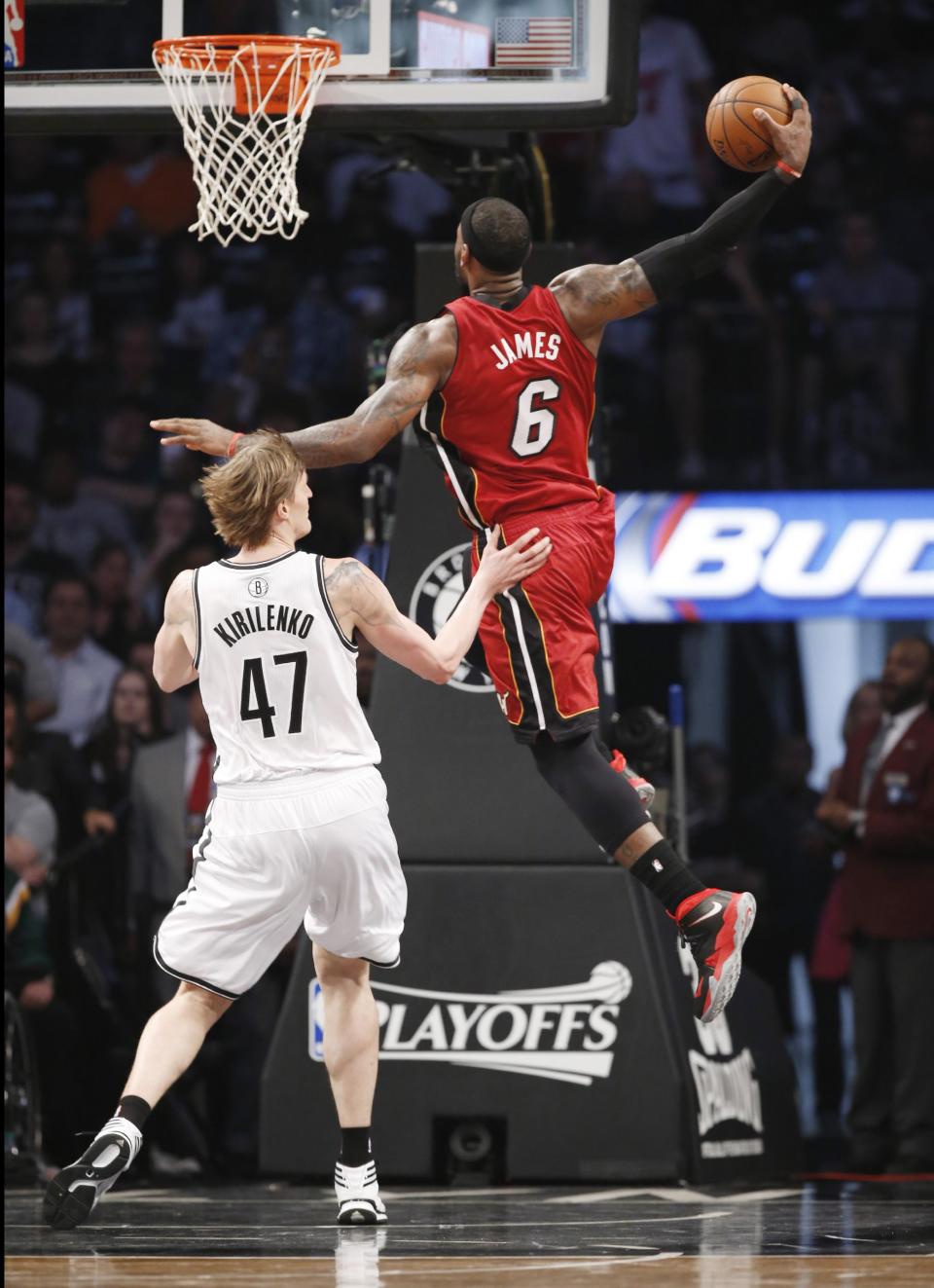 Miami Heat forward LeBron James (6) scores over Brooklyn Nets forward Andrei Kirilenko (47) in the first half of Game 4 of a second-round NBA playoff basketball game at the Barclays Center, Monday, May 12, 2014, in New York. (AP Photo)