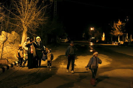 Residents, who say they have received permission from the Syrian government to leave the besieged town, depart after an aid convoy entered Madaya, Syria January 11, 2016. REUTERS/Omar Sanadiki