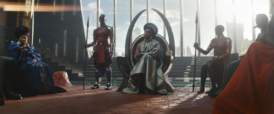 (L-R): Dorothy Steel as Merchant Tribe Elder, Florence Kasumba as Ayo, Angela Bassett as Ramonda, Danai Gurira as Okoye in Marvel Studios' Black Panther: Wakanda Forever. Photo courtesy of Marvel Studios. Â© 2022 MARVEL.