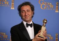 Producer Nicola Giuliano poses backstage with the award for Best Foreign Language Film for "The Great Beauty" at the 71st annual Golden Globe Awards in Beverly Hills, California January 12, 2014. REUTERS/Lucy Nicholson