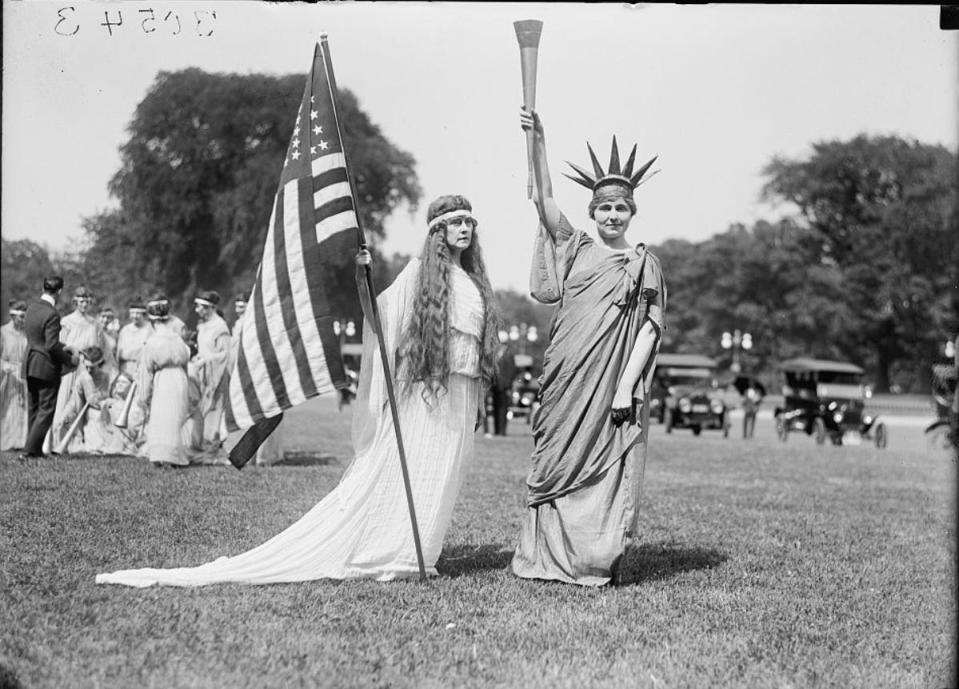 A Fourth of July tableau from 1919 on the Ellipse in Washington, D.C. From left, dancers, 'Columbia' and 'Liberty.'