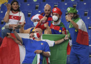 Fans take selfies with their phone before the Euro 2020 soccer championship group A match between Turkey and Italy at the Olympic stadium in Rome, Friday, June 11, 2021. (Ettore Ferrari/Pool via AP)