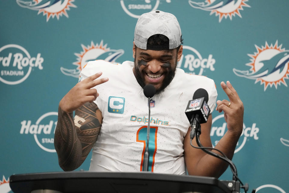 Miami Dolphins quarterback Tua Tagovailoa (1) gestures during a post-game news conference at an NFL football game, Sunday, Dec. 17, 2023, in Miami Gardens, Fla. The Dolphins defeated the Jets 30-0. (AP Photo/Rebecca Blackwell)