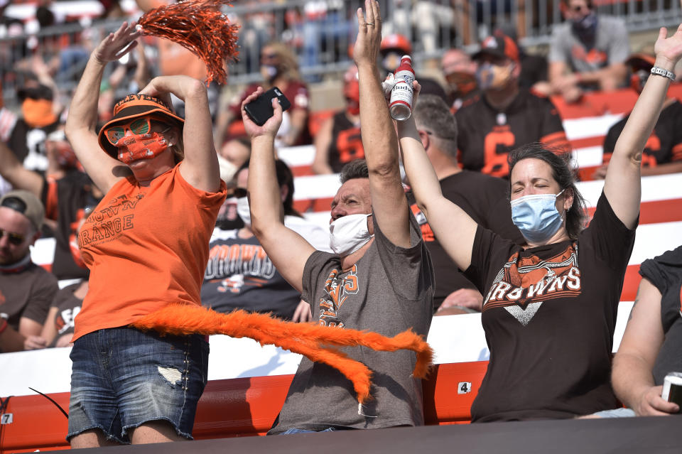 Cleveland Browns fans celebrate during the second half of an NFL football game against the Washington Football Team, Sunday, Sept. 27, 2020, in Cleveland. (AP Photo/David Richard)