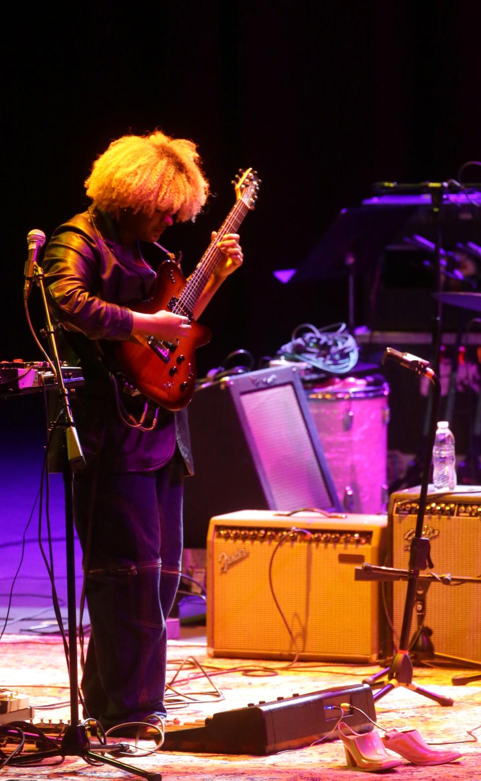 Lorraine shoes sit next to L'Rain on stage as she performs at the Mission Creek Festival Thursday, April 4, 2024 at Hancher Auditorium in Iowa City, Iowa.