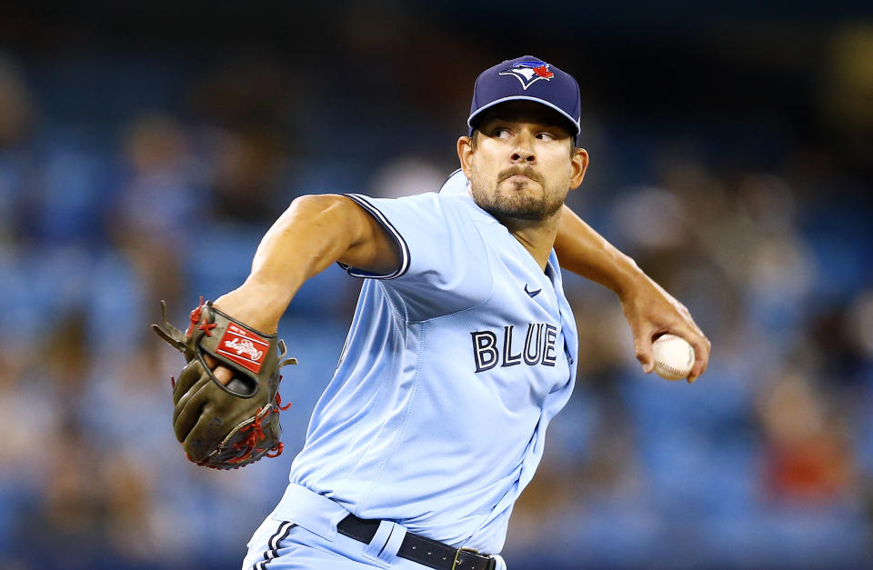 TORONTO, ON - JULY 30:  Brad Hand #52 of the Toronto Blue Jays delivers a pitch on his debut for the Blue Jays in the eighth inning during a MLB game against the Kansas City Royals at Rogers Centre on July 30, 2021 in Toronto, Canada.  (Photo by Vaughn Ridley/Getty Images)