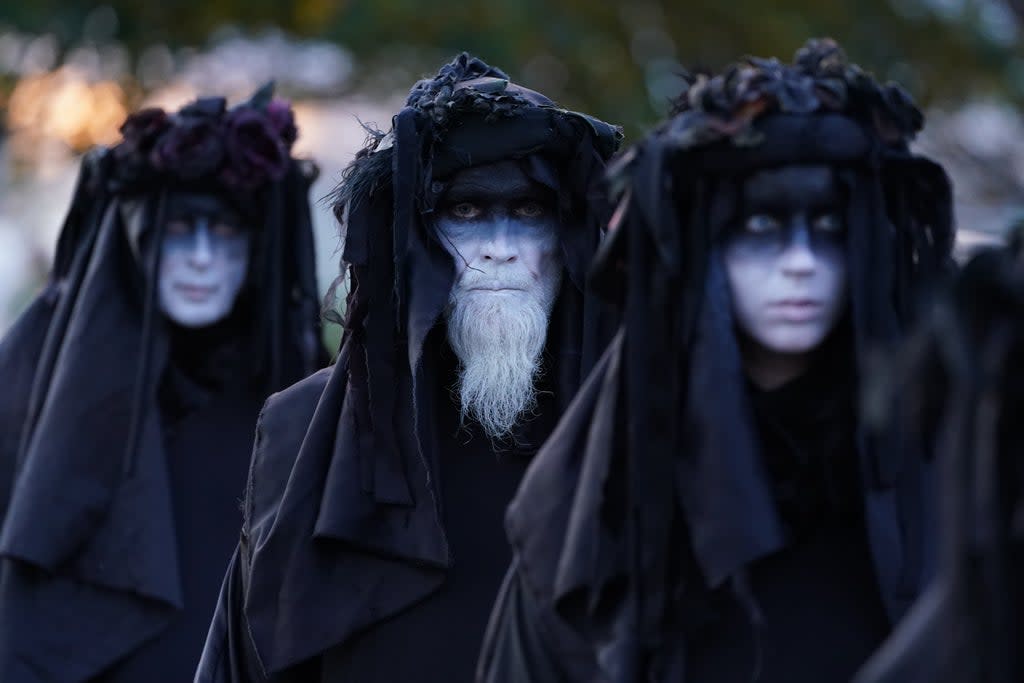 Climate activists from Ocean Rebellion, representing ‘oil slicks’ protest outside Grangemouth Oil Refinery in Falkirk (Andrew Milligan/PA) (PA Wire)