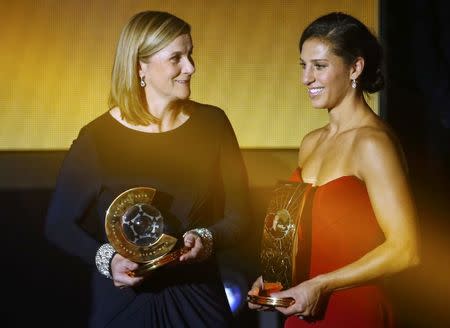 Winner of the 2015 Women's World Player of the Year award, Houston Dash's Carli Lloyd of the U.S. (R) and winner of the 2015 Women's World Coach of the Year Jill Ellis of the U.S. react during the FIFA Ballon d'Or ceremony in Zurich, Switzerland, January 11, 2016 REUTERS/Ruben Sprich