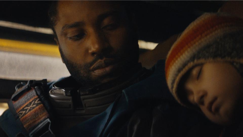 Joshua (John David Washington) and Alphie (Madeleine Yuna Voyles) together in The Creator