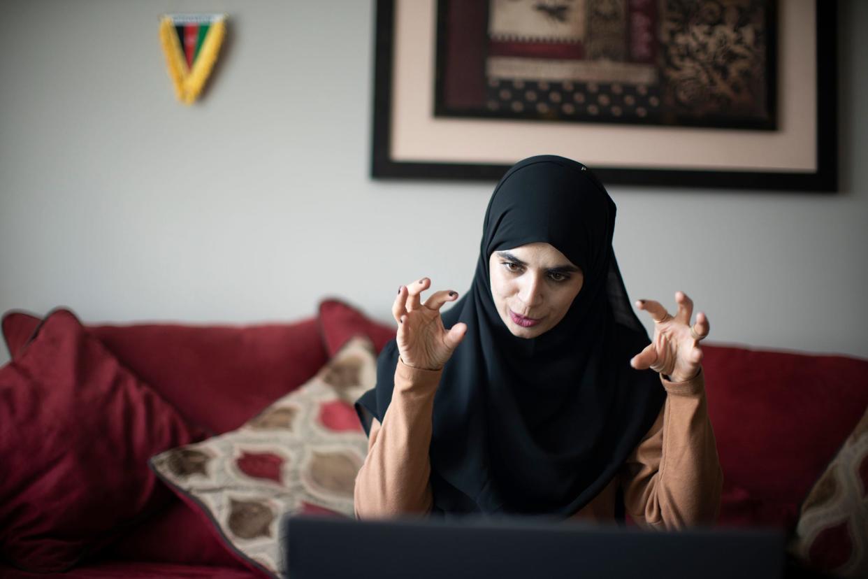 Sajida Saafi teaches English to other Afghan women in Columbus during daily online class in January 2023.