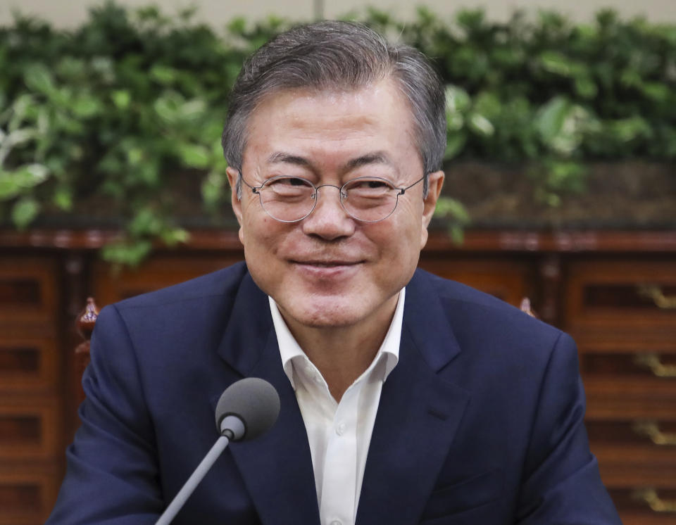 In this Thursday, Sept. 6, 2018, photo, South Korean President Moon Jae-in smiles as he presides over a meeting to make preparations for upcoming summit between South and North Korea in Pyongyang, North Korea, from Sept. 18-20 at the presidential Blue House in Seoul, South Korea. Moon said Friday, Sept. 7, that he's pushing for "irrevocable progress" on efforts to rid North Korea of its nukes by the end of this year as he prepares for his third summit with North Korean leader Kim Jong Un. (Hwang Gwang-mo/Yonhap via AP)