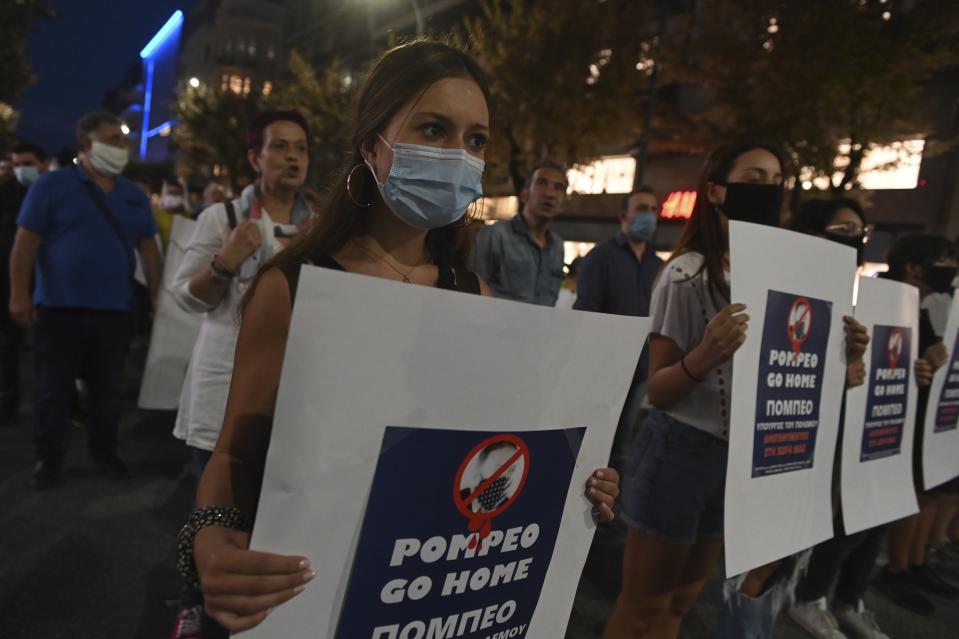 Protesters take part in a rally against the visit of the U.S. Secretary of State Mike Pompeo in Greece, in the northern city of Thessaloniki, on Monday, Sept. 28, 2020. Pompeo said Monday that Washington will use its diplomatic and military influence in the region to try to ease a volatile dispute between NATO allies Greece and Turkey over energy rights in the eastern Mediterranean. (AP Photo/Giannis Papanikos)