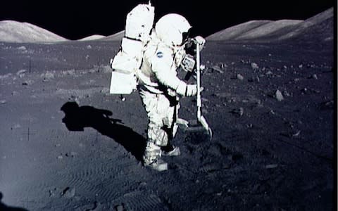 Harrison 'Jack' Schmitt collects lunar rock samples during his 1972 mission to the Moon  - Credit: AFP