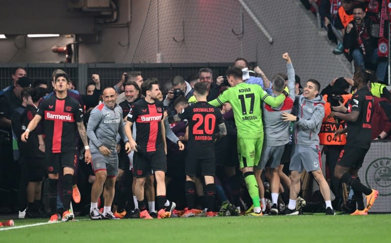 Leverkusen celebrates after defender <a class="link " href="https://sports.yahoo.com/soccer/players/1607345/" data-i13n="sec:content-canvas;subsec:anchor_text;elm:context_link" data-ylk="slk:Josip Stanisic;sec:content-canvas;subsec:anchor_text;elm:context_link;itc:0">Josip Stanisic</a> scored in the seventh minute of injury time to seal progress to the Europa League final (Kirill KUDRYAVTSEV)