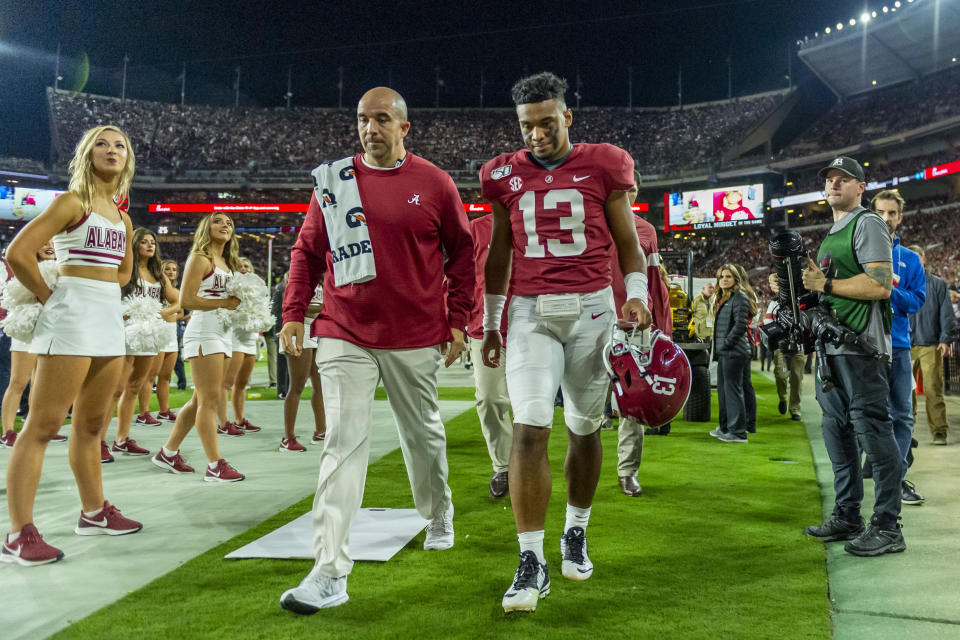 Alabama quarterback Tua Tagovailoa (13) walks off the field hurt against Tennessee during the first half of an NCAA college football game, Saturday, Oct. 19, 2019, in Tuscaloosa, Ala. (AP Photo/Vasha Hunt)