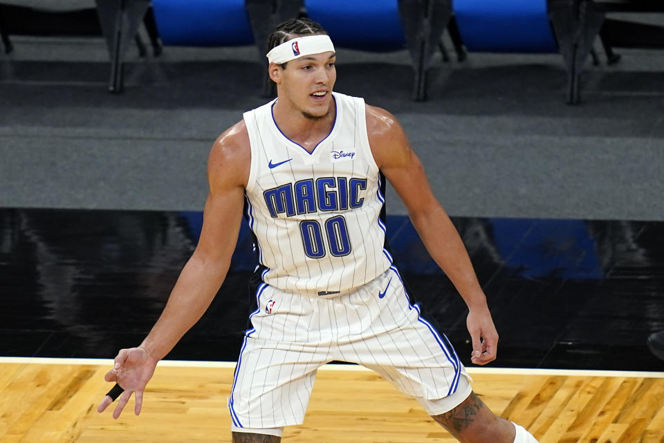 Orlando Magic forward Aaron Gordon gestures with his hand holding out 3 fingers after sinking a 3-point shot against the Cleveland Cavaliers during the second half of an NBA basketball game, Monday, Jan. 4, 2021, in Orlando, Fla. (AP Photo/John Raoux)