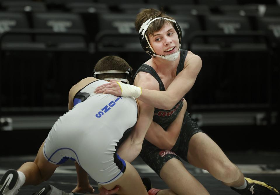 Logan’s Cooper Redd, right, wrestles Stansbury’s Lorenzo Call in the 4A Wrestling State Championships at the UCCU Center in Orem on Friday, Feb. 16, 2024. | Laura Seitz, Deseret News