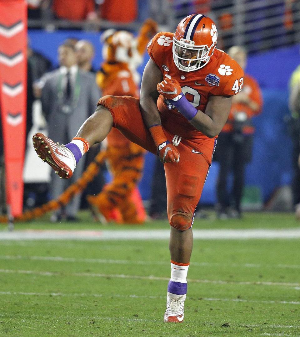 Clemson defensive lineman Christian Wilkins (42) celebrates a stop against Ohio State during the second half of the Fiesta Bowl NCAA college football playoff semifinal, Saturday, Dec. 31, 2016, in Glendale, Ariz. (AP Photo/Ross D. Franklin)