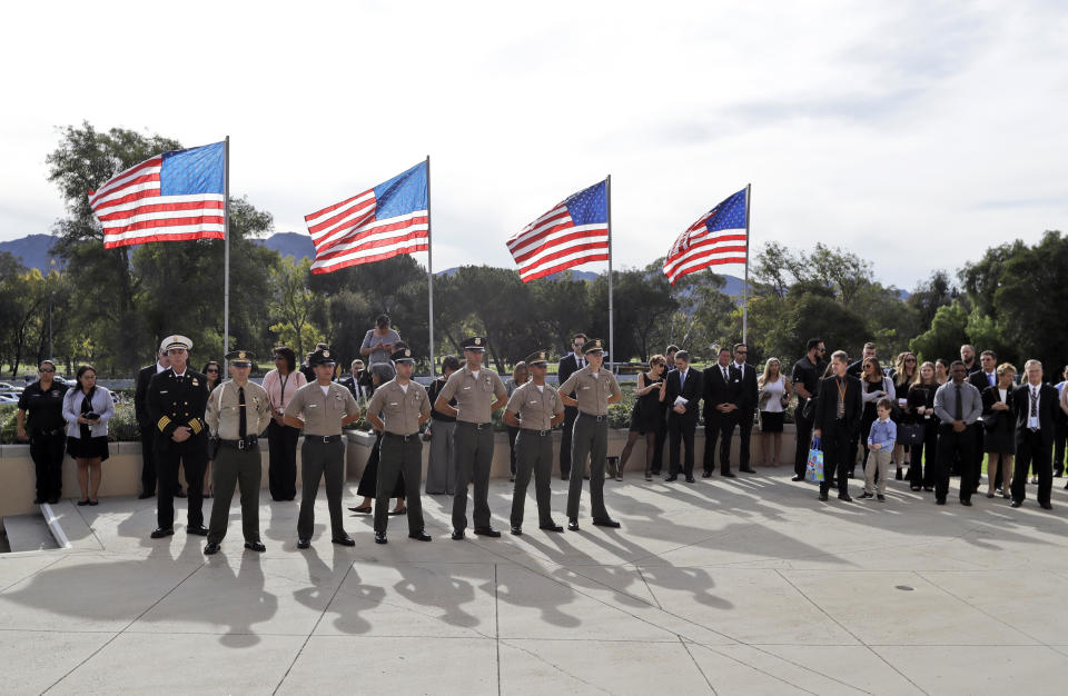 Law enforcement personnel stand at attention during a memorial service for Ventura County Sheriff's Sgt. Ron Helus at the Calvary Community Church Thursday, Nov. 15, 2018, in Westlake Village, Calif. (AP Photo/Marcio Jose Sanchez, Pool)
