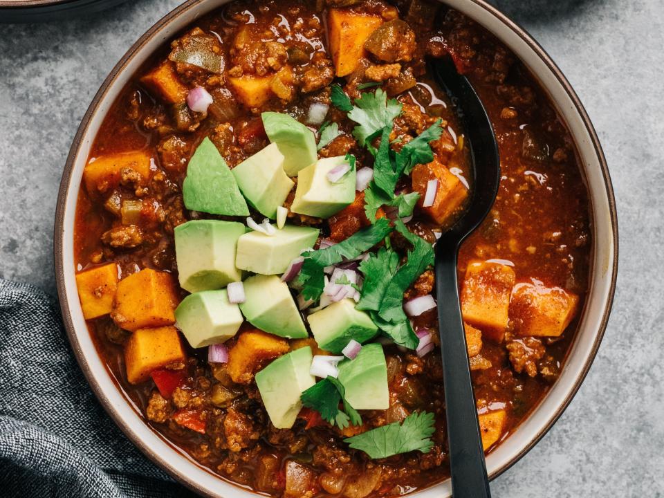 Vegetarian chili with avocados.