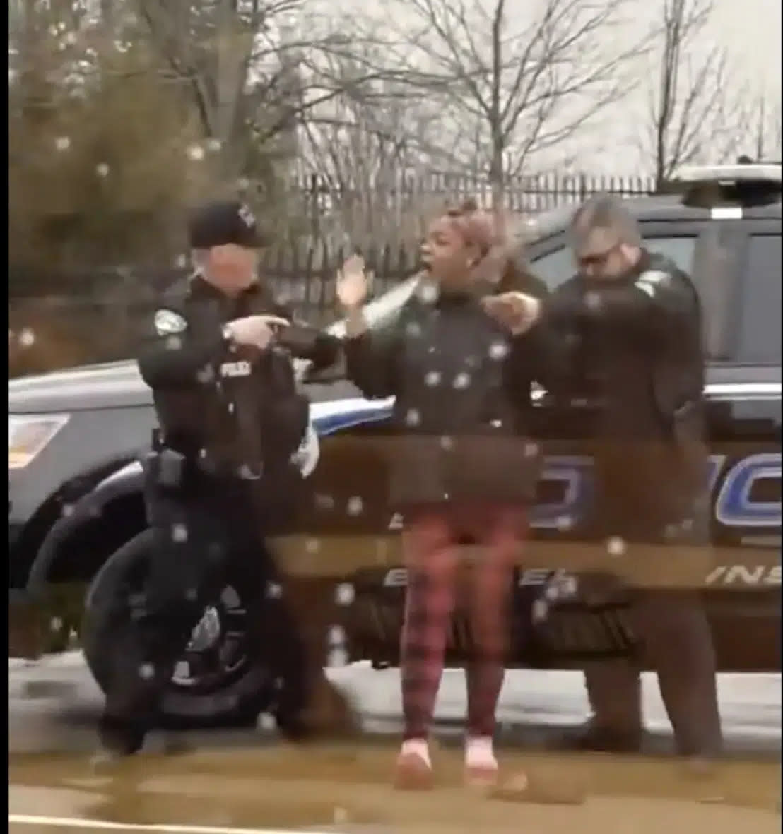 A screen grab from video showing Butler Township officers Sgt. Tim Zellers, left, and Todd Stanley, right, restrain and arrest Laticka Hancock outside a McDonald’s restaurant in Butler Township, Ohio, on Monday, Jan. 16, 2023. (Mario Robinson/ LOCAL NEWS X /TMX via AP)