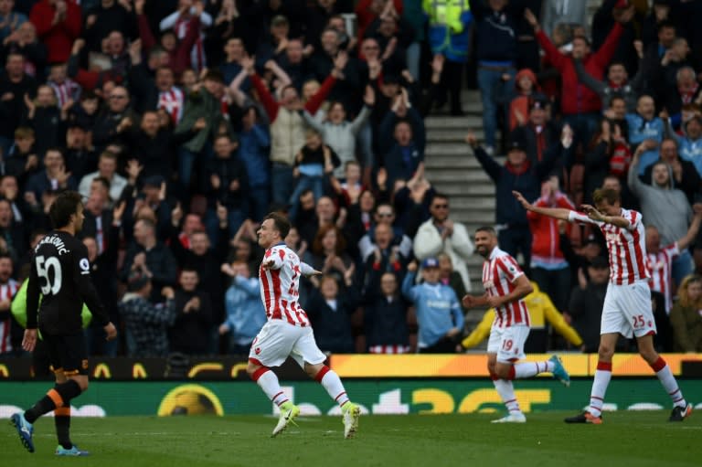 Stoke City's Xherdan Shaqiri (2L) celebrates scoring their third goal against Hull City at the Bet365 Stadium in Stoke-on-Trent, central England on April 15, 2017