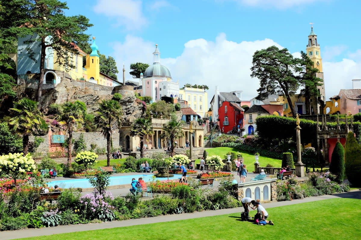 Take in the colourful sight of Portmeirion’s village gardens (Getty Images)