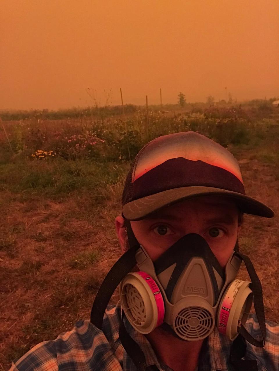 Farmer Conner Voss wears a mask at <a href="https://digginrootsfarm.com/">Diggin&rsquo; Roots Farm</a> in Oregon's Willamette Valley. (Photo: Courtesy of Conner Voss)