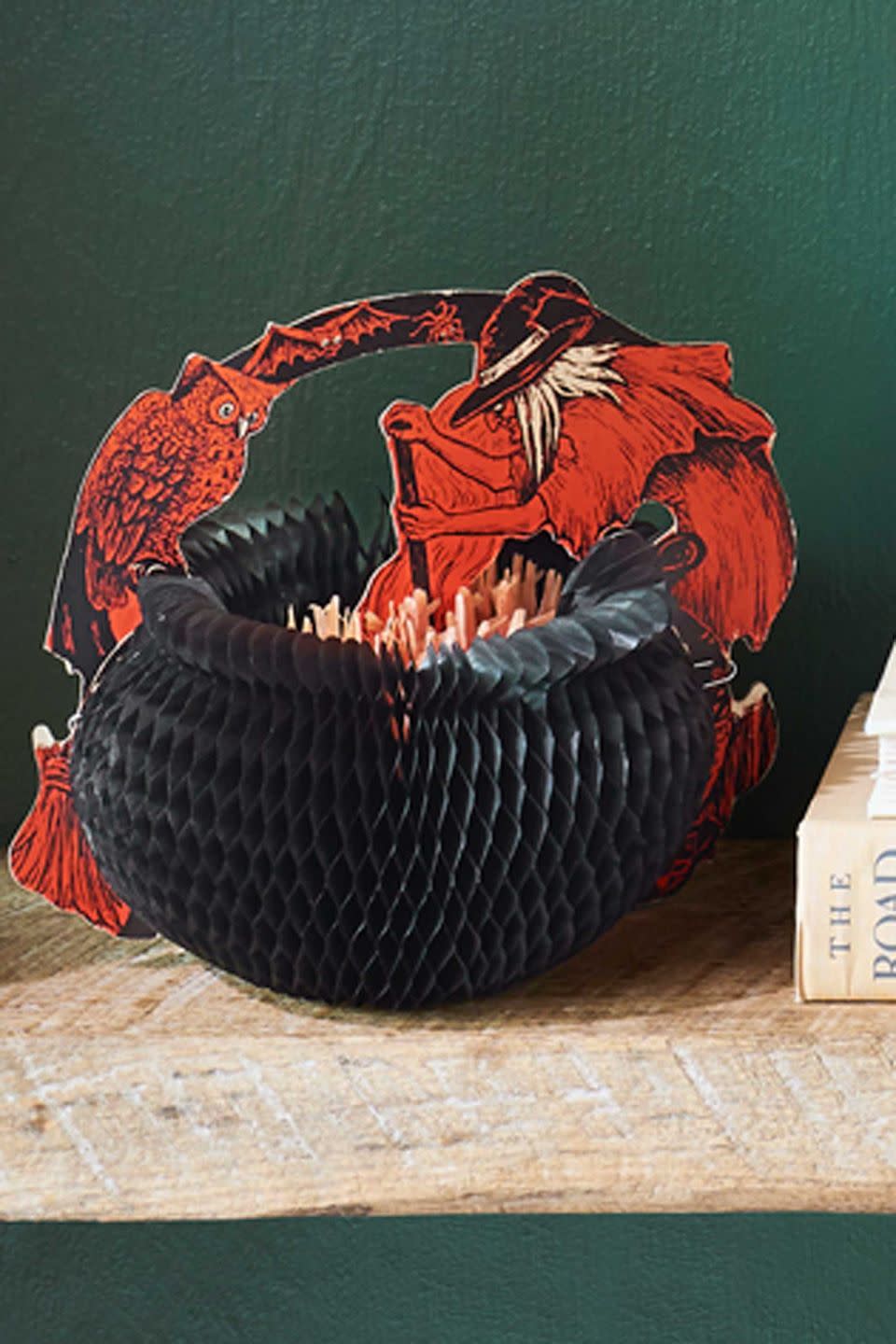 <p>Prone to damage—it's very rare to find an example with an intact arch—this 1929 honeycomb witch and cauldron from Beistle  originally came in three different sizes. This—the middle-sized version—stirs up an impressive value of $350.</p>