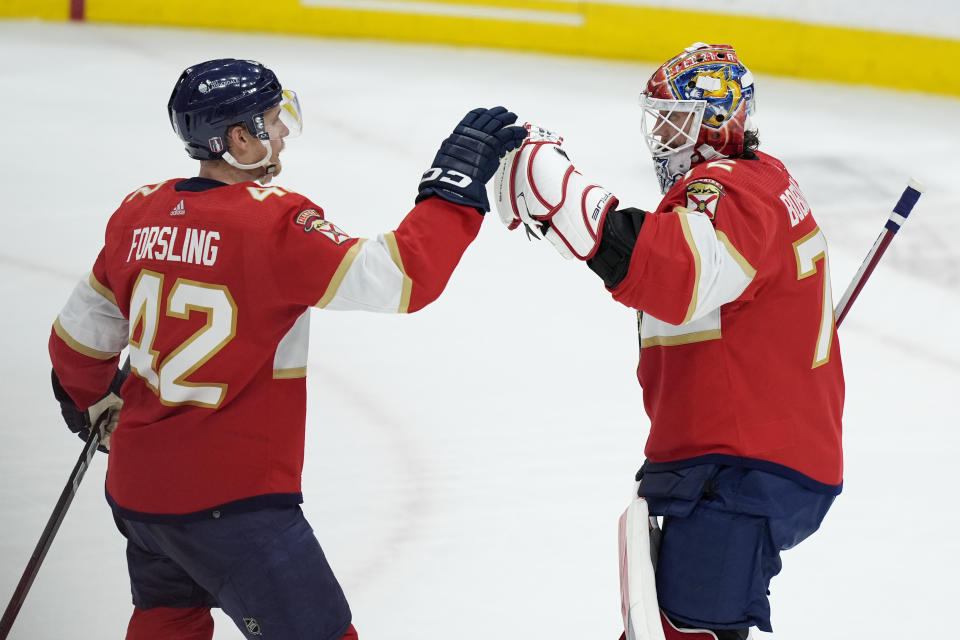 Florida Panthers defenseman Gustav Forsling (42) greets goaltender Sergei Bobrovsky after the Panthers defeated the Boston Bruins in Game 2 of a second-round series of the NHL hockey Stanley Cup playoffs Wednesday, May 8, 2024, in Sunrise, Fla. (AP Photo/Lynne Sladky)