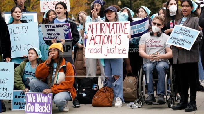 People rally outside the Supreme Court Monday as the court begins to hear oral arguments in two cases that could decide the future of affirmative action in college admissions. (Photo: J. Scott Applewhite/AP)