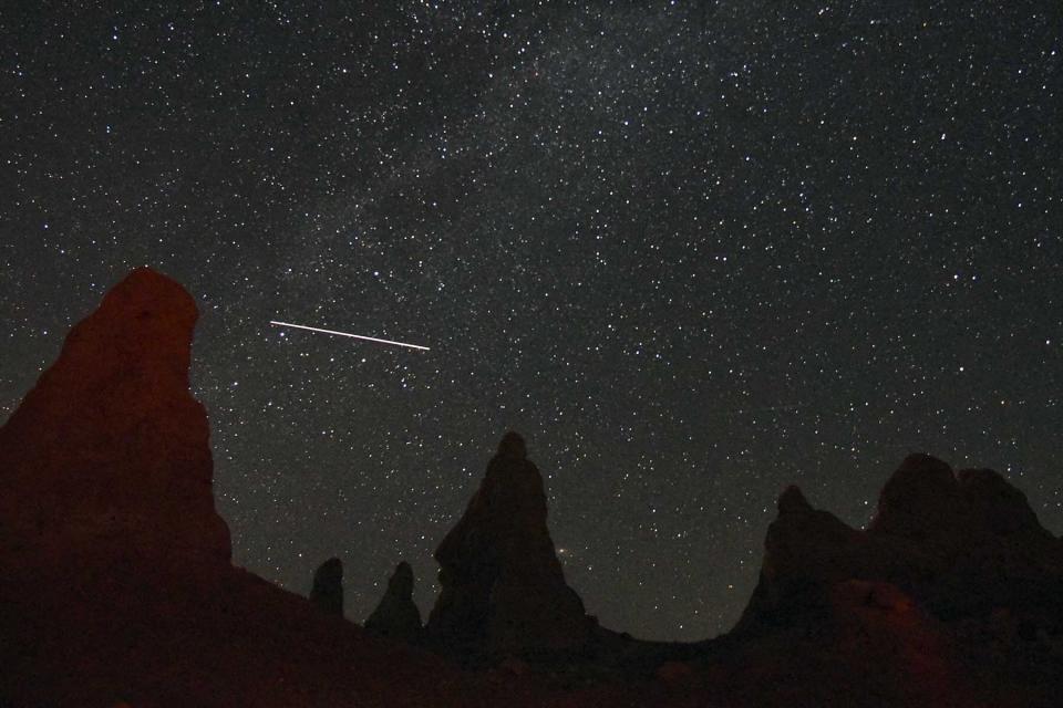 View of meteorite streaking over Trona Pinnacles near Death Valley, CA during annual Perseid Meteor Showers, August 2, 2019.