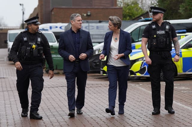 Labour leader Sir Keir Starmer with shadow home secretary Yvette Cooper talking to officers during a visit to Milton Keynes police station, Buckinghamshire 