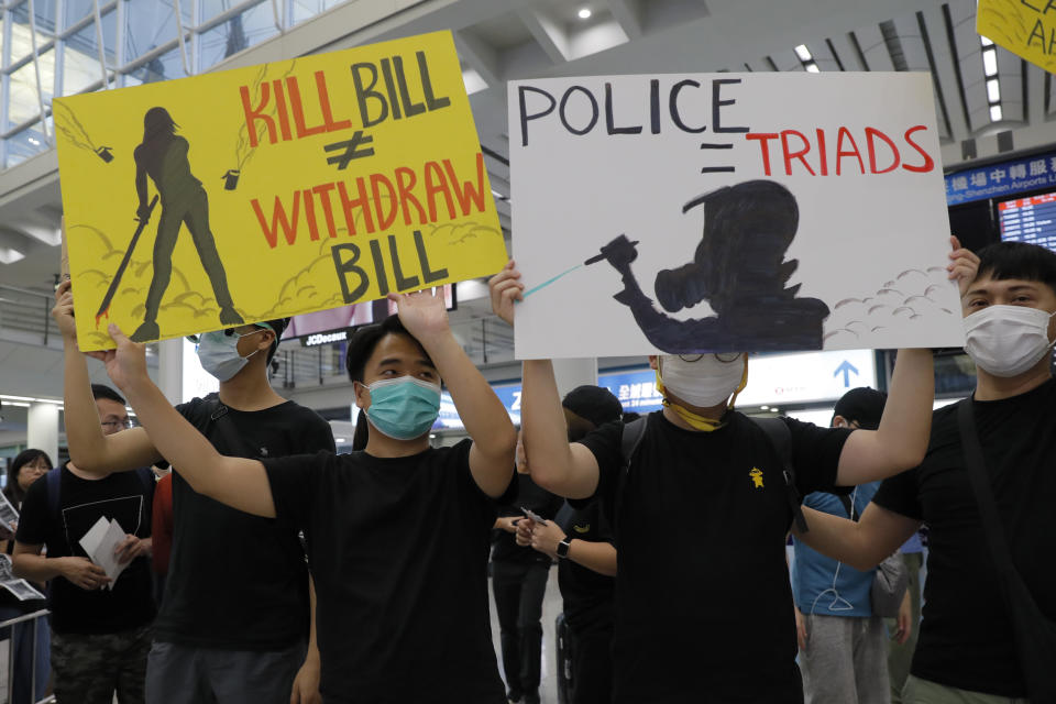 Thousands take part in a second day of sit-in protest at the airport in Hong Kong on Saturday, Aug. 10, 2019. Hong Kong is in its ninth week of demonstrations that began in response to a proposed extradition law but have expanded to include other grievances and demands for more democratic freedoms. (AP Photo/Kin Cheung)