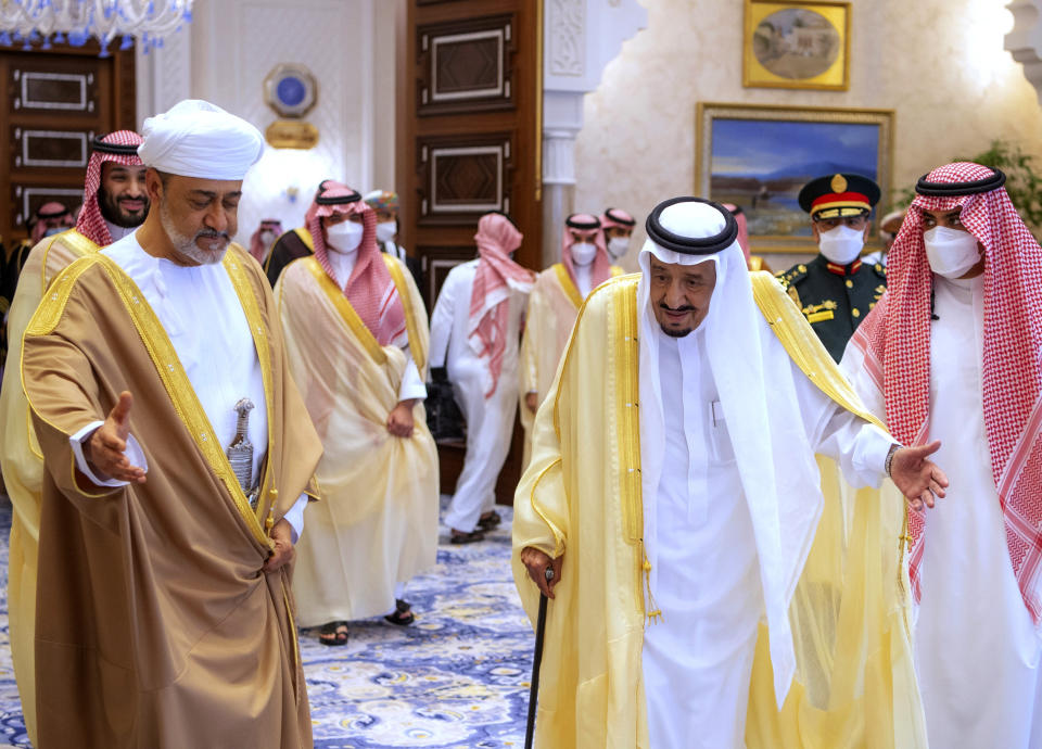 In this photo released by Saudi Royal Palace, Saudi King Salman, third right, welcomes Omani Sultan Haitham bin Tariq, at Neom Royal Palace, in the Tabuk Province of northwestern Saudi Arabia, Sunday, July 11, 2021. Sultan Haitham started the first visit by an Omani ruler in years against the backdrop of renewed diplomatic efforts to end the war in Yemen and the sultanate’s worsening economic woes. (Bandar Aljaloud/Saudi Royal Palace via AP)