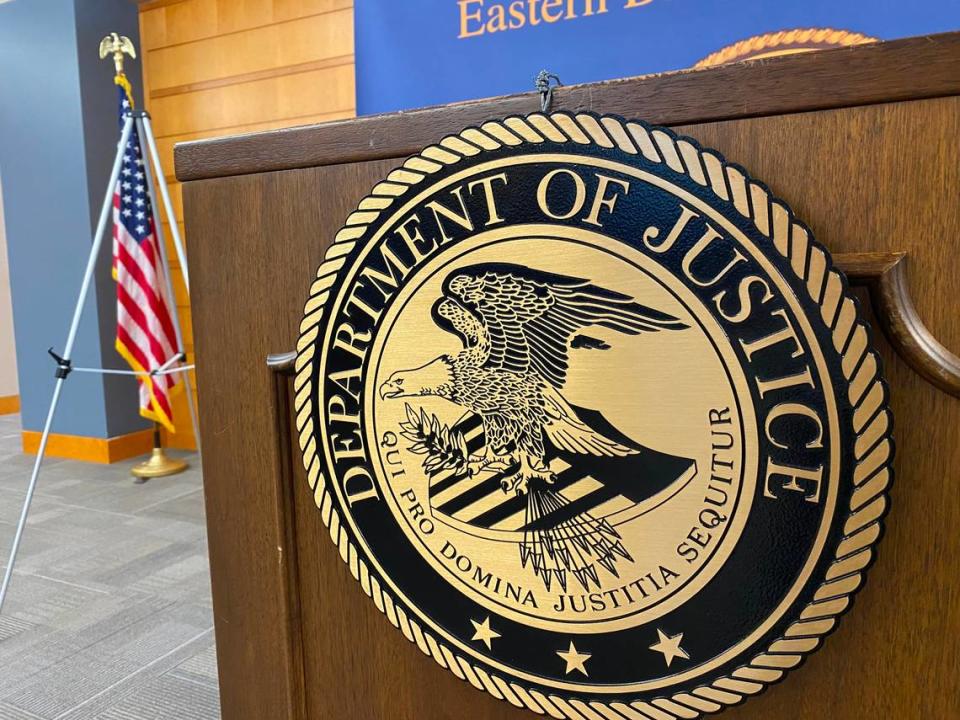 A seal of the U.S. Department of Justice hangs from a lectern in the Robert E. Coyle U.S. Courthouse, 2500 Tulare St., in Fresno on Thursday, July 27, 2023. THADDEUS MILLER/tmiller@fresnobee.com