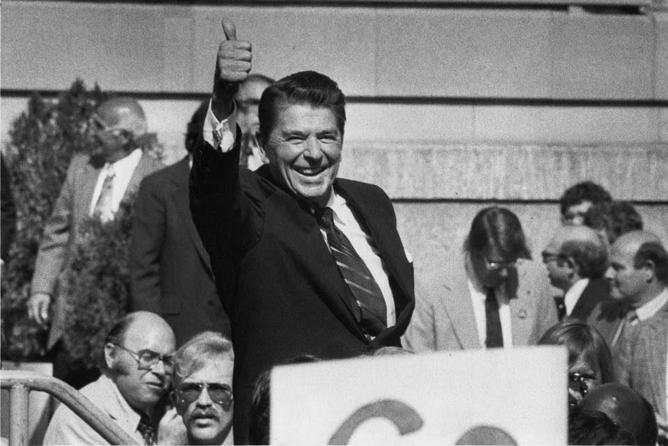 Unlike former President Donald Trump, former President Ronald Reagan, seen here in 1980 in New Jersey, rejected dark rhetoric and campaigned on optimist themes dubbed "Morning in America."