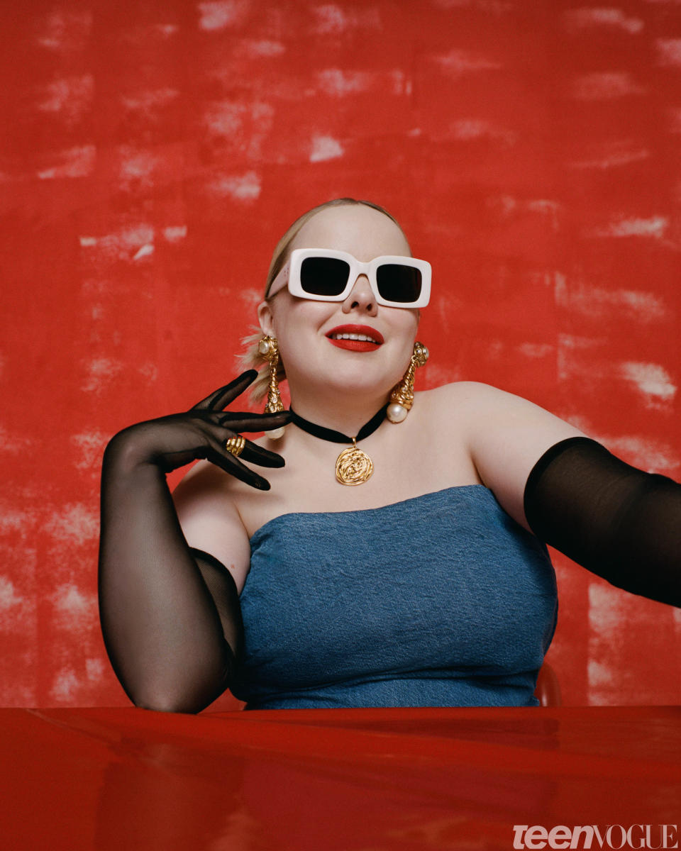 Nicola Coughlan wears a [Tanya Taylor top](https://www.tanyataylor.com/), [Raen sunglasses](https://raen.com/collections/all-sunglasses), [Sterling King necklace](https://sterlingkingny.com/), [Susan Alexandra ring](https://www.susanalexandra.com/collections/earrings), and vintage earrings.