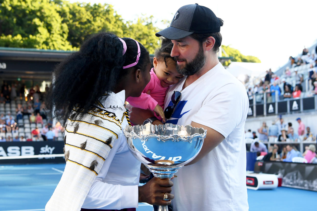 Alexis Ohanian congratulates wife Serena Williams with their daughter, Alexis. (Hannah Peters / Getty Images)