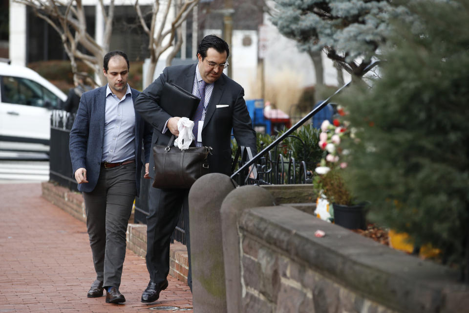 In this Jan. 28, 2020 photo, Jordan Sekulow, right, the executive director of American Center for Law and Justice, opens a gate as he arrives at a property on Capitol Hill in Washington. (AP Photo/Patrick Semansky)