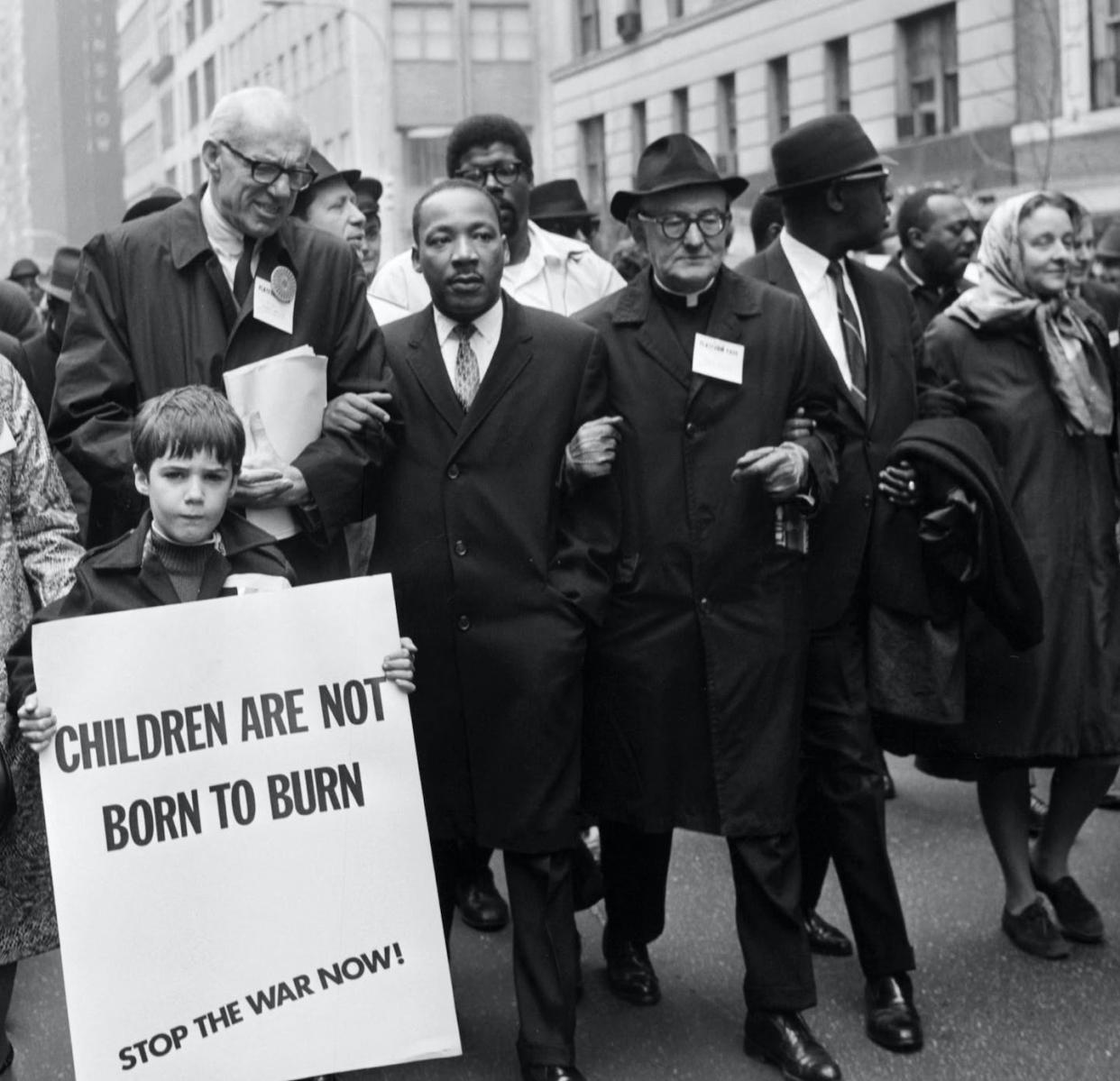 Civil rights leader Martin Luther King Jr., center, leads an anti-Vietnam War demonstration on March 16, 1967, in New York City. <a href="https://www.gettyimages.com/detail/news-photo/civil-rights-leader-rev-martin-luther-king-jr-is-news-photo/150253595?adppopup=true" rel="nofollow noopener" target="_blank" data-ylk="slk:AFP via Getty Images;elm:context_link;itc:0;sec:content-canvas" class="link ">AFP via Getty Images</a>