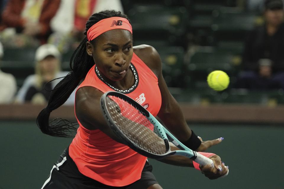 Coco Gauff returns a shot to Cristina Bucsa, of Spain, at the BNP Paribas Open tennis tournament Friday, March 10, 2023, in Indian Wells, Calif. (AP Photo/Mark J. Terrill)
