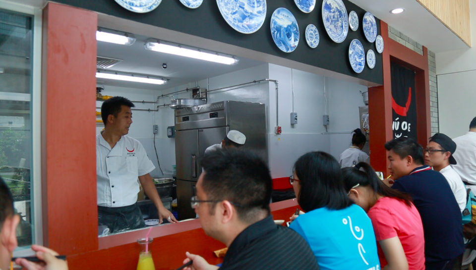 Customers dining at NUODLE, a popular F&B brand from China that recently opened its first overseas outlet at SingPost Centre. (Photo: Nurul Azliah/Yahoo Lifestyle Singapore)