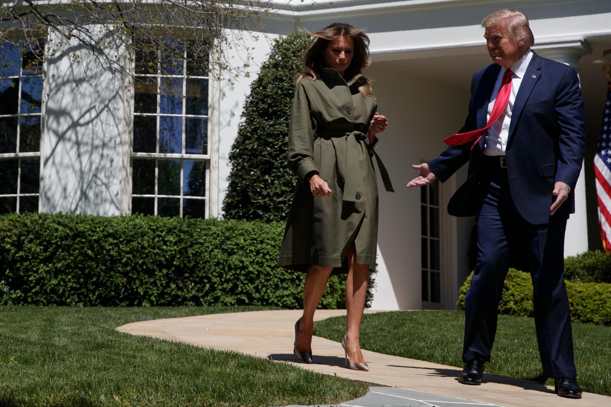 President Donald Trump and first lady Melania Trump arrive for a tree planting ceremony to celebrate Earth Day, on the South Lawn of the White House, Wednesday, April 22, 2020, in Washington. (AP Photo/Evan Vucci)