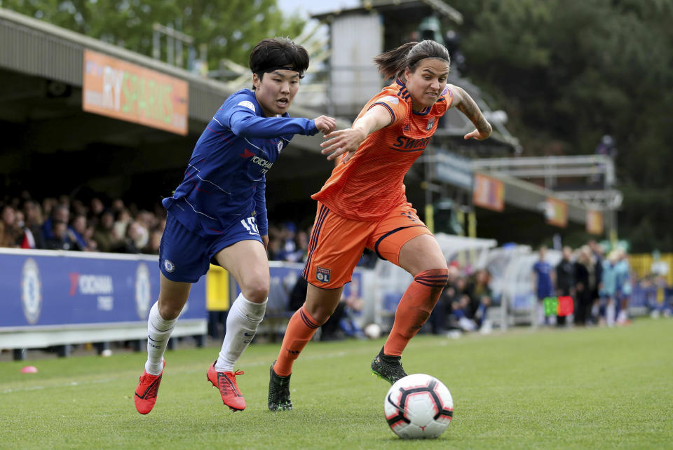 Chelsea's Ji So Yun, left, in action with Lyon's Dzsenifer Marozsan during their UEFA Women's Champions League semi final second leg soccer match at the Cherry Red Records Stadium, London, Sunday, April 28, 2019. (Bradley Collyer/PA via AP)