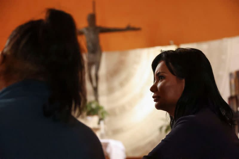 Carla stands inside the Blessed Immaculate Virgin Church in Torvaianica