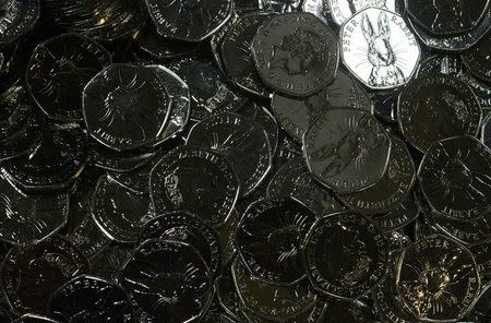New fifty pence coins are seen at The Royal Mint, in Llantrisant, Wales, Britain, January 25, 2017. Picture taken January 25, 2017. REUTERS/Rebecca Naden