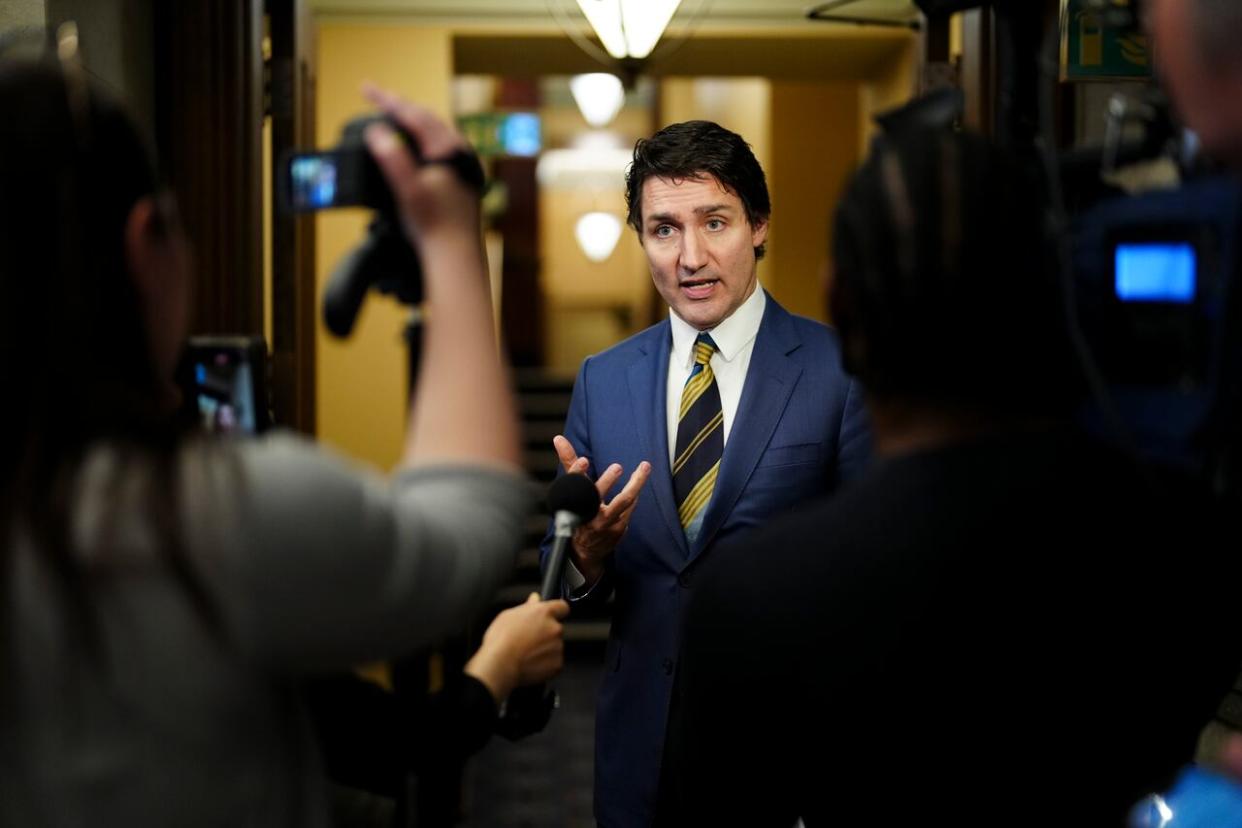 Prime Minister Justin Trudeau speaks to reporters in the foyer of the House of Commons on Parliament Hill in Ottawa on Wednesday, Dec. 13, 2023. (Sean Kilpatrick/The Canadian Press - image credit)