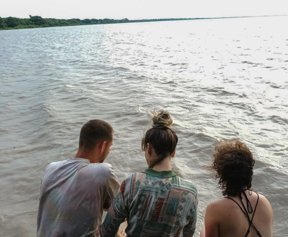 Claire Bye with friends at a river in Santa Rosa de Yacuma, Bolivia minutes before she was attacked by a dolphin (Courtesy Claire Bye / SWNS)